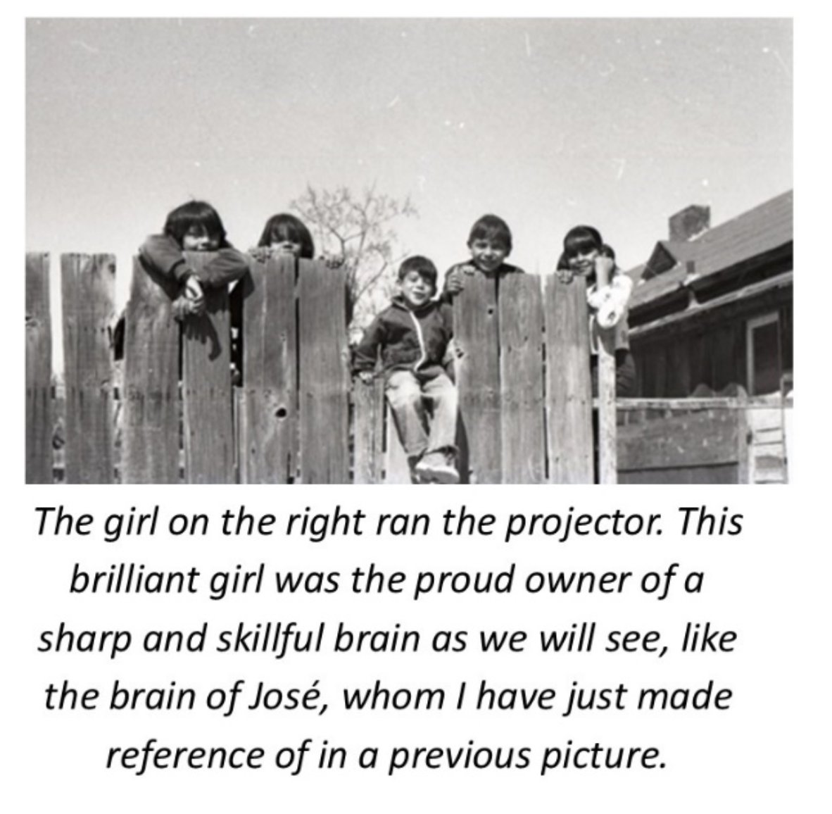 A group of people sitting behind a fence

Description automatically generated with low confidence