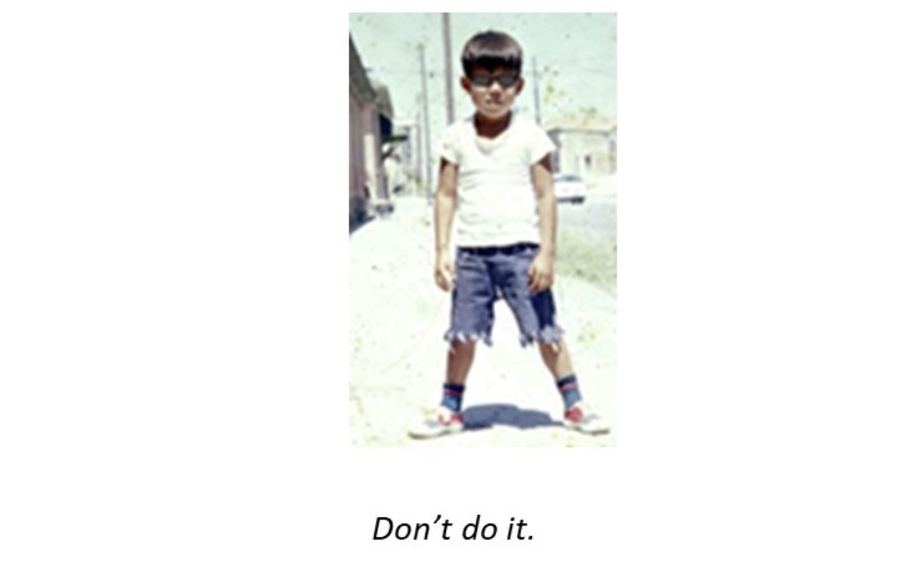 A young child wearing ripped shorts and a white shirt

Description automatically generated with low confidence
