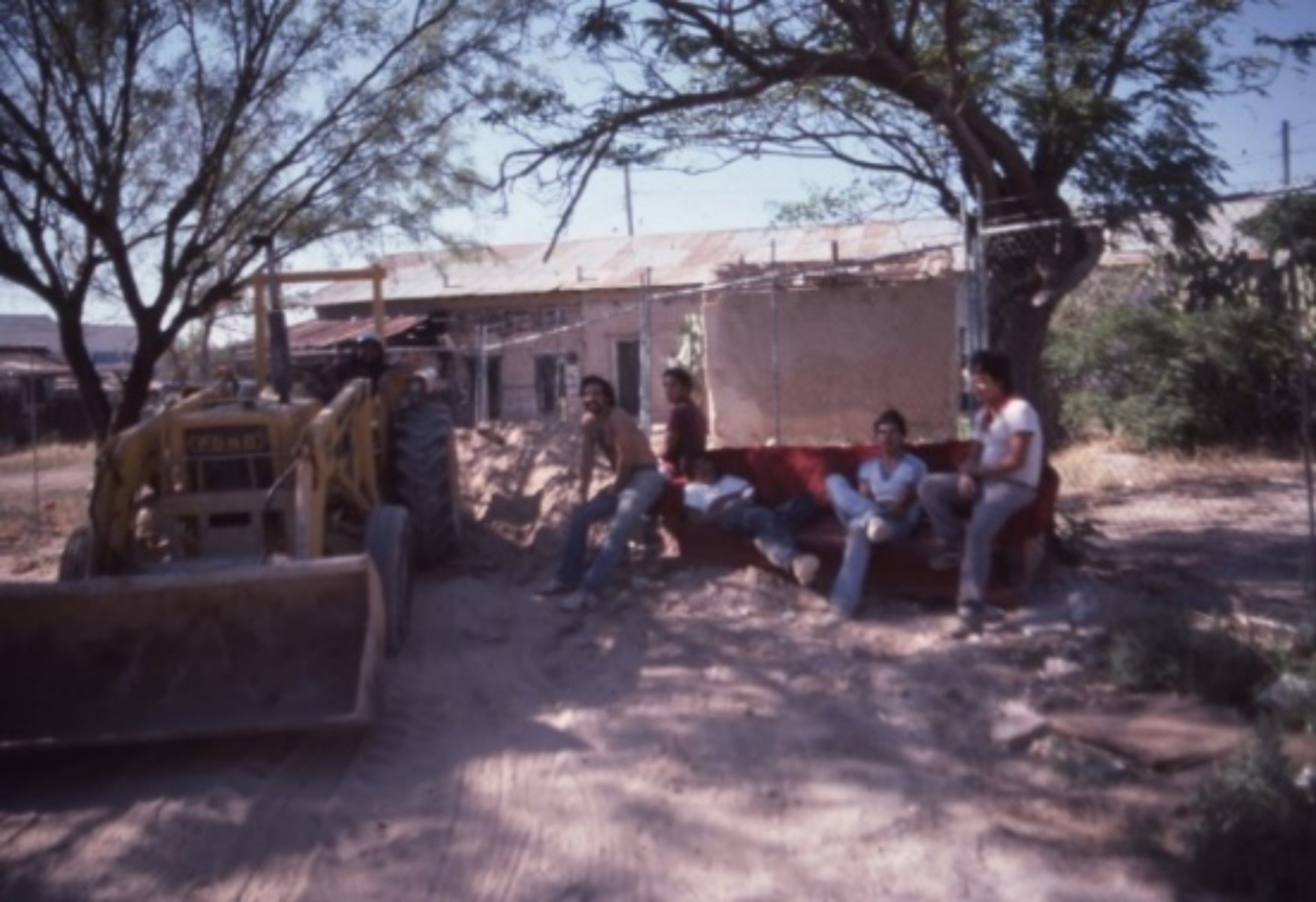A group of people sitting on a bench

Description automatically generated